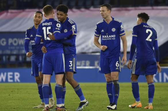 Leicester's players celebrate their win.