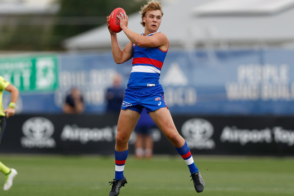 Dog to watch: Ryley Sanders marks the ball during the match simulation.