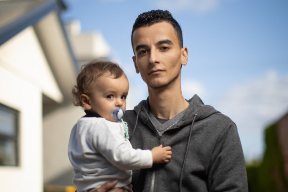 Karam Ismail with his son, Oday, outside their suburban Melbourne townhouse.