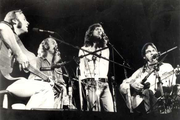 Nash perfomring with Crosby, Stills, Nash and Young in 1974 on their first reunion tour.
