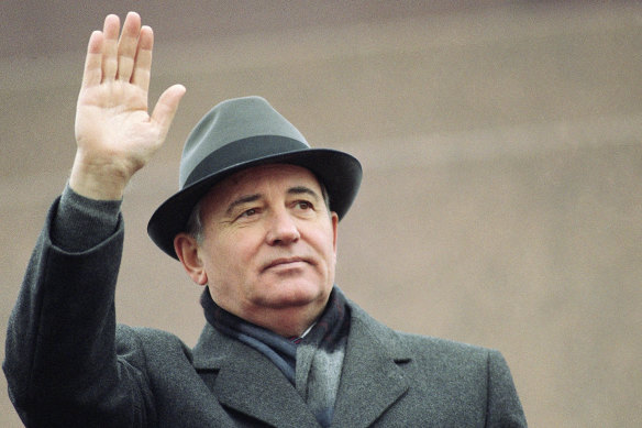 Soviet President Mikhail Gorbachev waves from the Red Square tribune during a Revolution Day celebration, in Moscow, Soviet Union, Tuesday, Nov. 7, 1989.