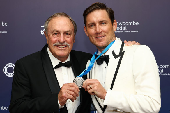 Matt Ebden poses with John Newcombe, and the medal named in his honour.