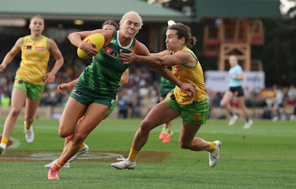 Aussie Ashe Riddell lays a tackle against her Irish opponent Orla O’Dwyer.
