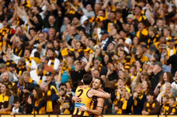 Hawthorn heroes Mitch Lews and Jack Gunston embrace after their team’s thrilling Easter Monday win.