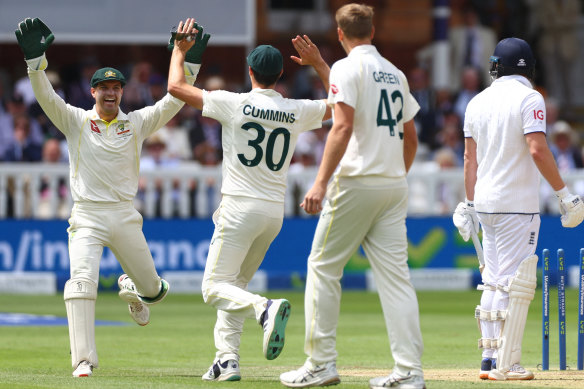 Alex Carey and Pat Cummins celebrate Jonny Bairstow’s wicket.