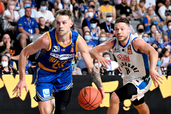 Matthew Dellavedova (right) battles Brisbane’s Nathan Sobey.