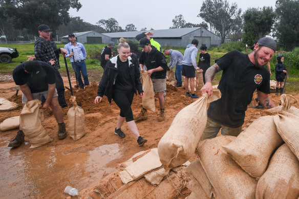 Rochester residents prepare sandbags before the flooding.