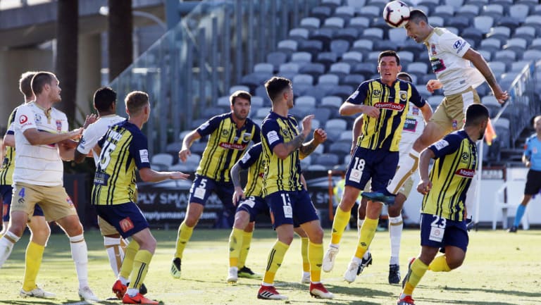 Heads up: Jason Hoffman soars above the Mariners to score during the Jets' 2-1 F3 derby win.