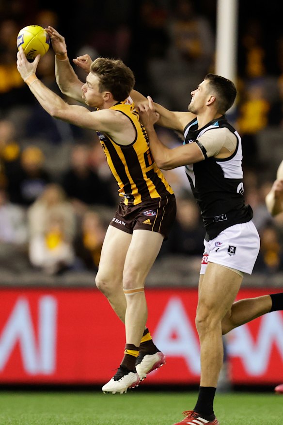 Ryan Burton (right) playing against his old side Hawthorn.