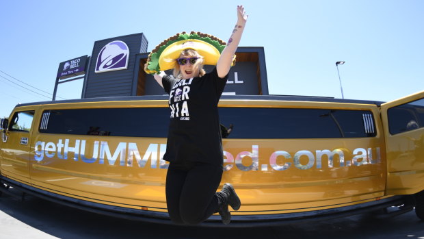 Ashlea Russell in her giant Taco hat before she is driven back to Brisbane Airport in a stretch limousine.