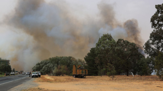 A bushfire burns on January 23, 2020 in Canberra, Australia. The fire on Kallaroo road in Pialligo by Canberra Airport remains at watch and act level, after being downgraded overnight. (Photo by Mark Evans/Getty Images)