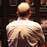 A visitor in Berlin looks at pictures of people killed in the Hamas attack on an Israeli music festival on October 7, 2023.