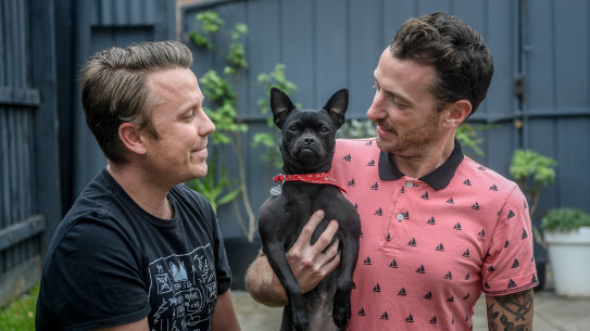 Ryan Stevens and Drew Grove recently adopted Banshee, a 13-month-old dog, from the RSPCA.
