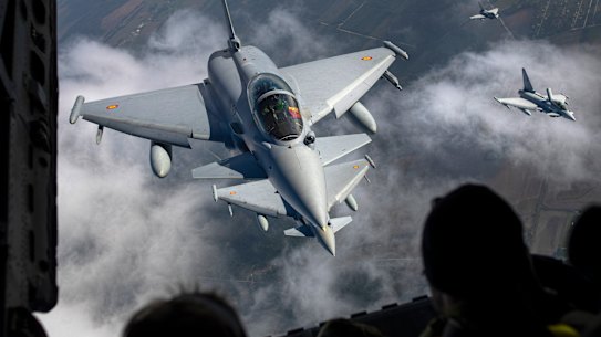 Spanish Air Force Eurofighter Typhoon military fighter jets, left, and Italian Air Force Eurofighter Typhoon military fighter jets, right, participating in NATO’s Baltic Air Policing Mission operate in Lithuanian airspace.