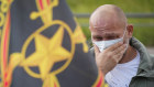 A man cries at a makeshift memorial for Prigozhin in St Petersburg.