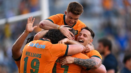 The Wallabies celebrate a great win in Townsville.