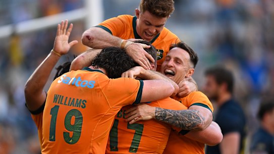 The Wallabies celebrate a great win in Townsville.
