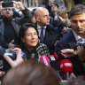 Georgian President Salome Zourabichvili, centre, after voting at a polling station on Saturday.