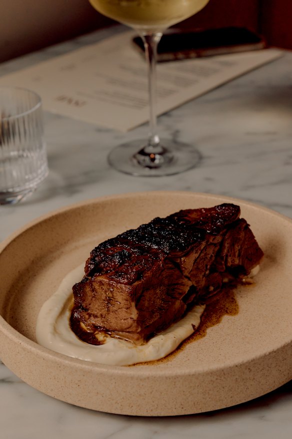 Slow-cooked lamb shoulder with garlic yoghurt.