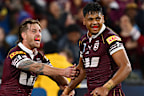 Selwyn Cobbo and Cameron Munster celebrate a try.