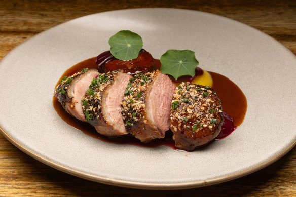 Dry-aged duck breast, with golden beet, pistachio and duck neck sausage.