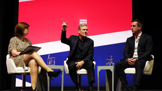 Shadow culture secretary Lucy Powell, Labour leader Sir Keir Starmer (centre) and former England football player Gary Neville on day two of the Labour Party Conference.