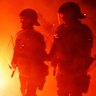 Police out in force as fans set off flares in Swan Street, Richmond, ahead of the A-League grand final.