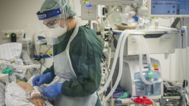A nurse looks after a COVID-19 patient in the intensive care unit of a hospital in Essen, Germany this week.