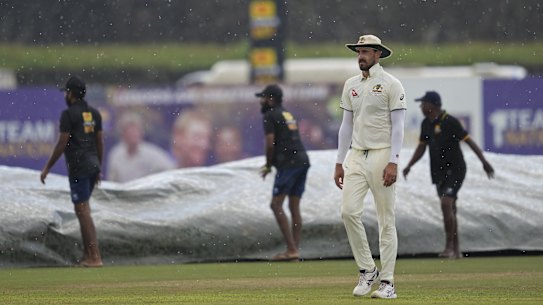 Mitchell Starc leaves the ground as rain stops play during day three of the first test cricket match betwe.