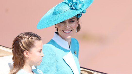 Princess Charlotte rides in the carriage with the Princess of Wales.