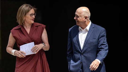 Premier Jacinta Allan accompanies Tim Pallas, who has stood down as treasurer.