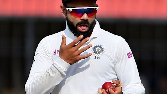 India's captain Virat Kohli shines the ball during the Test match against Bangladesh last year.