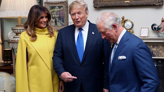 Then Prince Charles, right, pose for a photo with US President Donald Trump and wife Melania, during a trip to London to attend the 70th anniversary of NATO in 2019. 