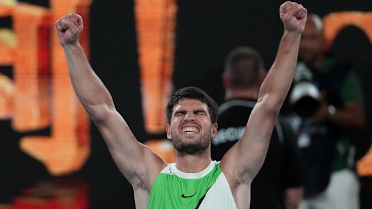 Carlos Alcaraz of Spain celebrates after defeating Alex de Minaur of Australia in their quarterfinal match at the Australian Open tennis championship in Melbourne, Australia, Tuesday, Jan. 27, 2026. (AP Photo/Dita Alangkara)