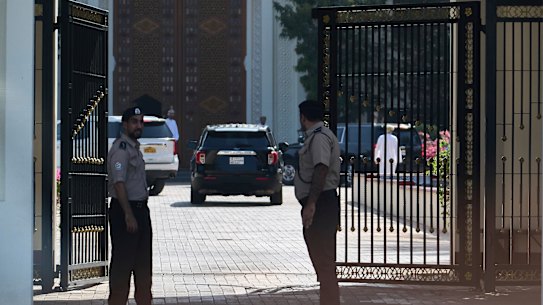 Omani security personnel watch a convoy believed to be carrying US envoy Steve Witkoff in Muscat, Oman, on Saturday.