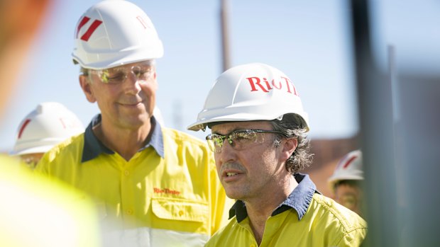 Simon Trott, flanked by Jakob Staustholm, at Rio Tinto’s Western Range mine in June.
