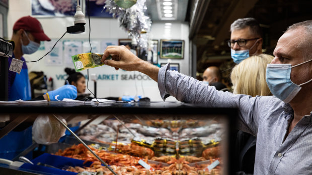 Customers shopping at Queen Victoria Market.