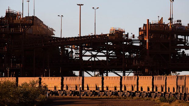 An iron ore train departs the BHP Billiton port facility