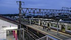 The first morning train leaving Hatsushima station after the new building, made from 3D-printed components, was assembled in Arida, Japan. 