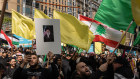 Protesters in Melbourne hold up a placard of Iranian leader Ayatollah Ali Khamenei as they march through the city.