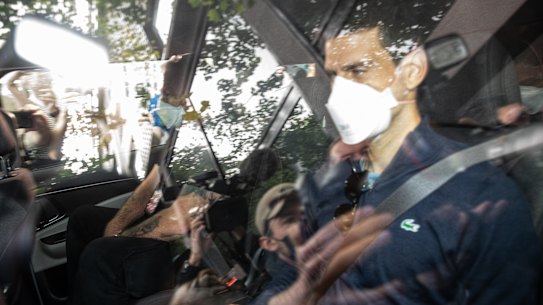 MELBOURNE, AUSTRALIA - JANUARY 16: Serbian tennis player Novak Djokovic leaves the Park hotel on January 16, 2022 in Melbourne, Australia. Djokovic is in detention and faces deportation after his visa was cancelled by the Australian government. His appeal will be heard today, one day before he is scheduled to play in the Australian Open. (Photo by Diego Fedele/Getty Images)