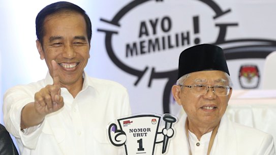 Indonesian President Joko Widodo (left) with his running mate, conservative Muslim figure Ma'ruf Amin. 