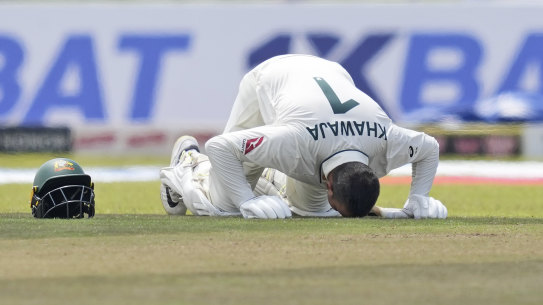 Usman Khawaja bows in prayer after reaching 200.