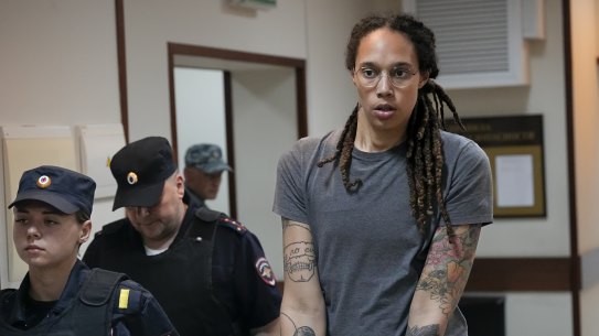 WNBA star and two-time Olympic gold medallist Brittney Griner is escorted from a courtroom.