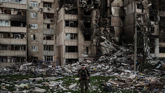 A Ukrainian serviceman walks amid the rubble of a building heavily damaged by multiple Russian bombardments near a frontline in Kharkiv, Ukraine.