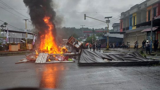 Fires burn during a violent protest in Manokwari, Papua province, Indonesia, Monday.