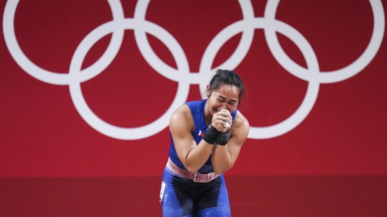 Hidilyn Diaz of the Philippines cries after winning the women’s 55kg weightlifting in Tokyo.