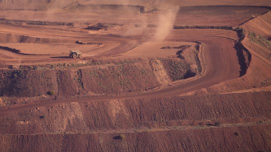 An iron ore truck drives through the Rio Tinto Marandoo mine site on the outskirts of Karijini National Park in Western Australia.