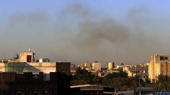 Smoke rises from the area around the international airport in Sanaa after the strikes.