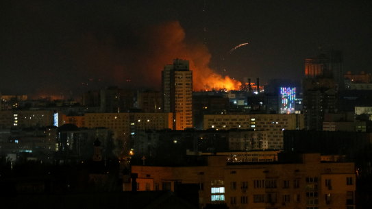 Smoke and flames rise over during the shelling near Kyiv.